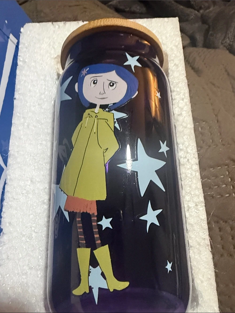 Purple Glass Bottle with Character Print and Yellow Lid